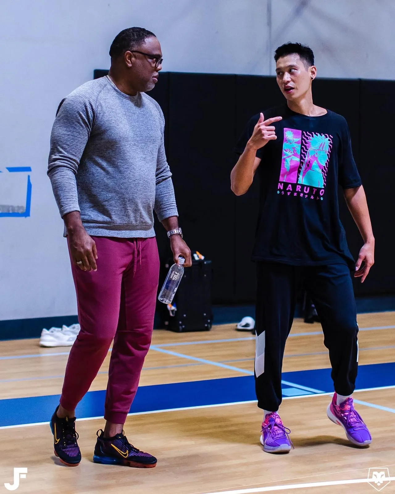 Roger Montgomery in conversation with Jeremy Lin on a basketball court